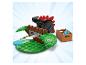 Dinozaur LEGO z czerwonymi kolcami, brązową konstrukcją i skrzynką niebieskich dysków.