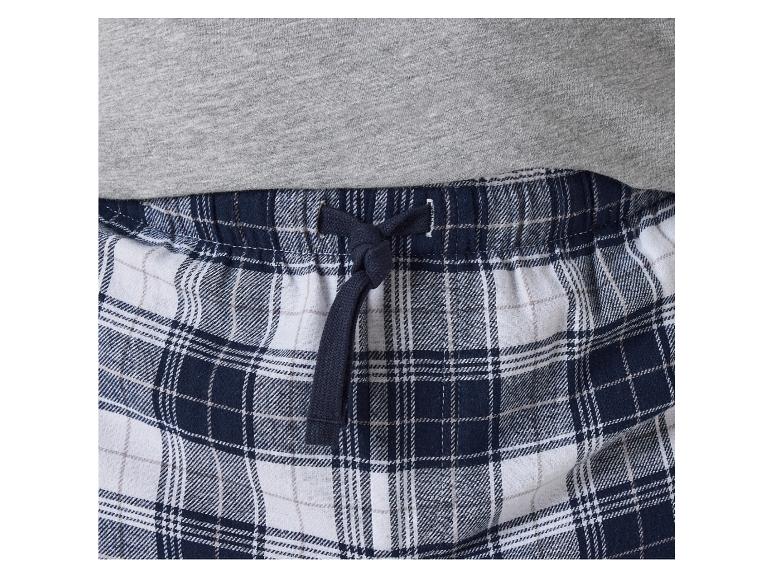 Spodnie do piżamy w niebiesko-białą kratę z gumką i sznurkiem.