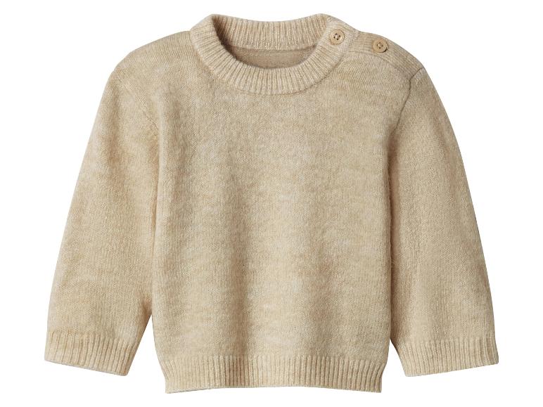 Beżowy sweter dziecięcy z dzianiny z guzikami na ramieniu