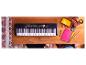 Yamaha PSR-E363 keyboard on a wooden table with school supplies.