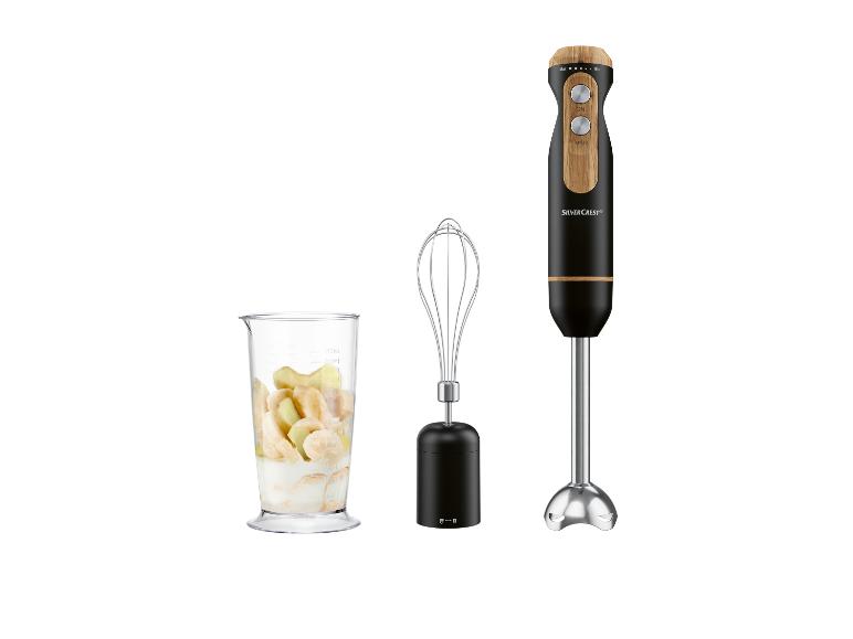 Blender ręczny Silvercrest, trzepaczka i dzbanek z bananami.