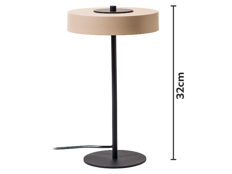 Beżowa lampa stołowa z czarną podstawą i trzonem, o wysokości 32 cm.