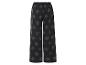 Szerokie czarne spodnie z wzorem liści.