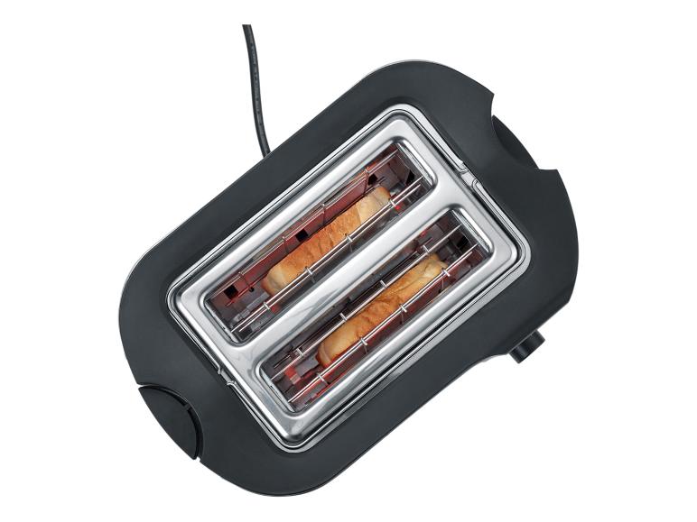 Czarny toster z dwoma kromkami chleba w środku, widok z góry