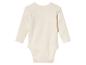 Kremowy body niemowlęcy z długim rękawem.