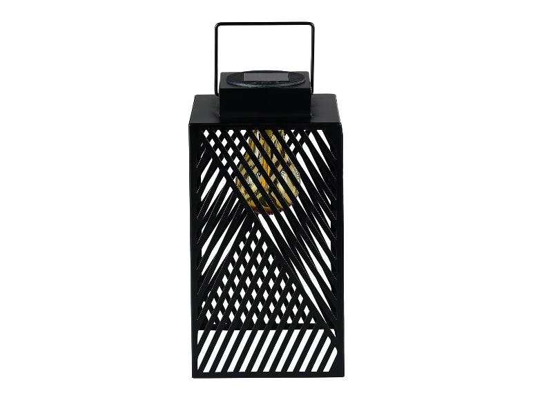 Czarna solarna latarnia z geometrycznym wzorem, wbudowane oświetlenie LED.