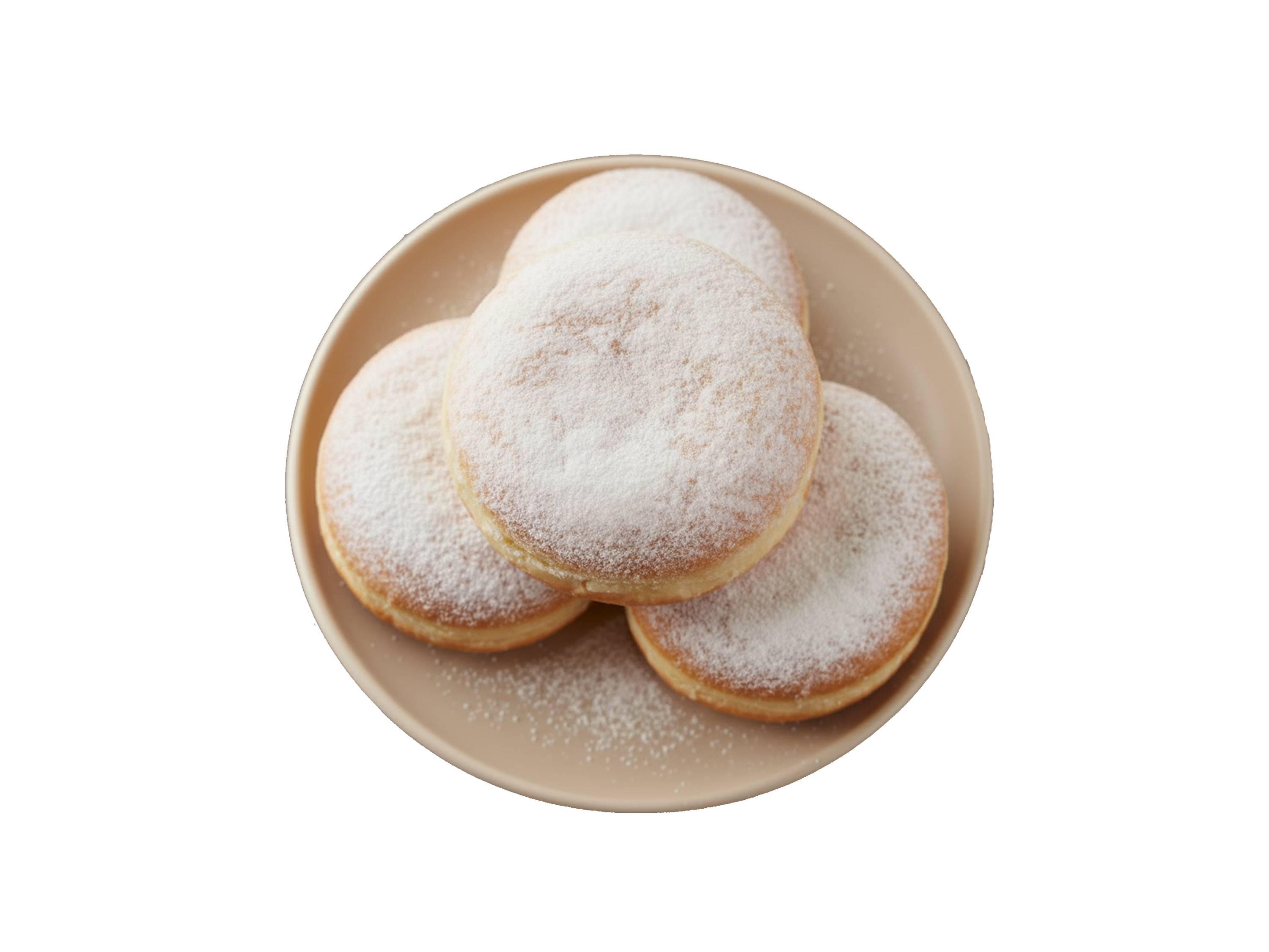 Pączki z cukrem pudrem na beżowym talerzu.