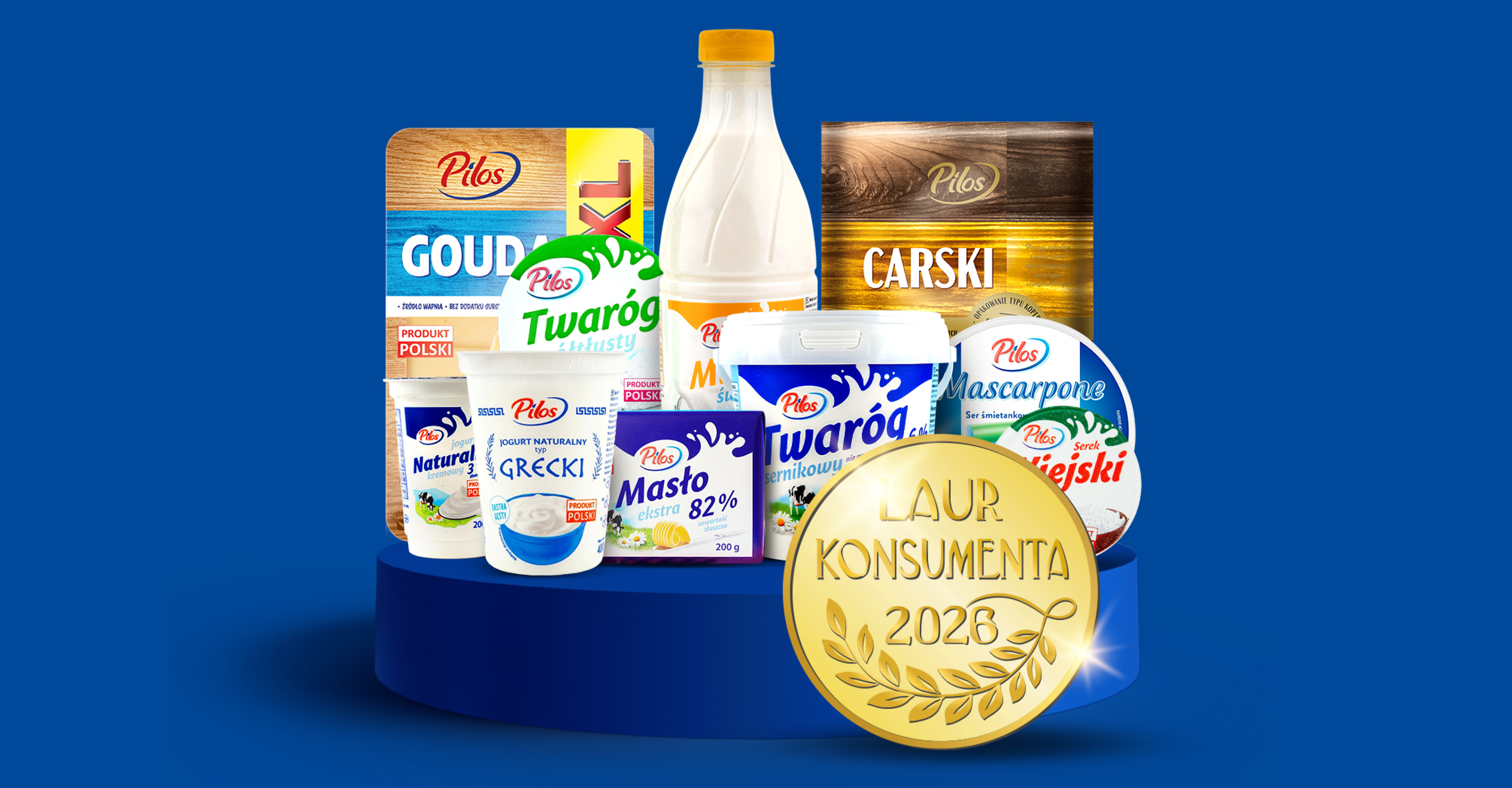 Asortyment produktów mlecznych, w tym ser Gouda, twaróg, jogurty, masło i serek wiejski, z nagrodą Laur Konsumenta 2026.