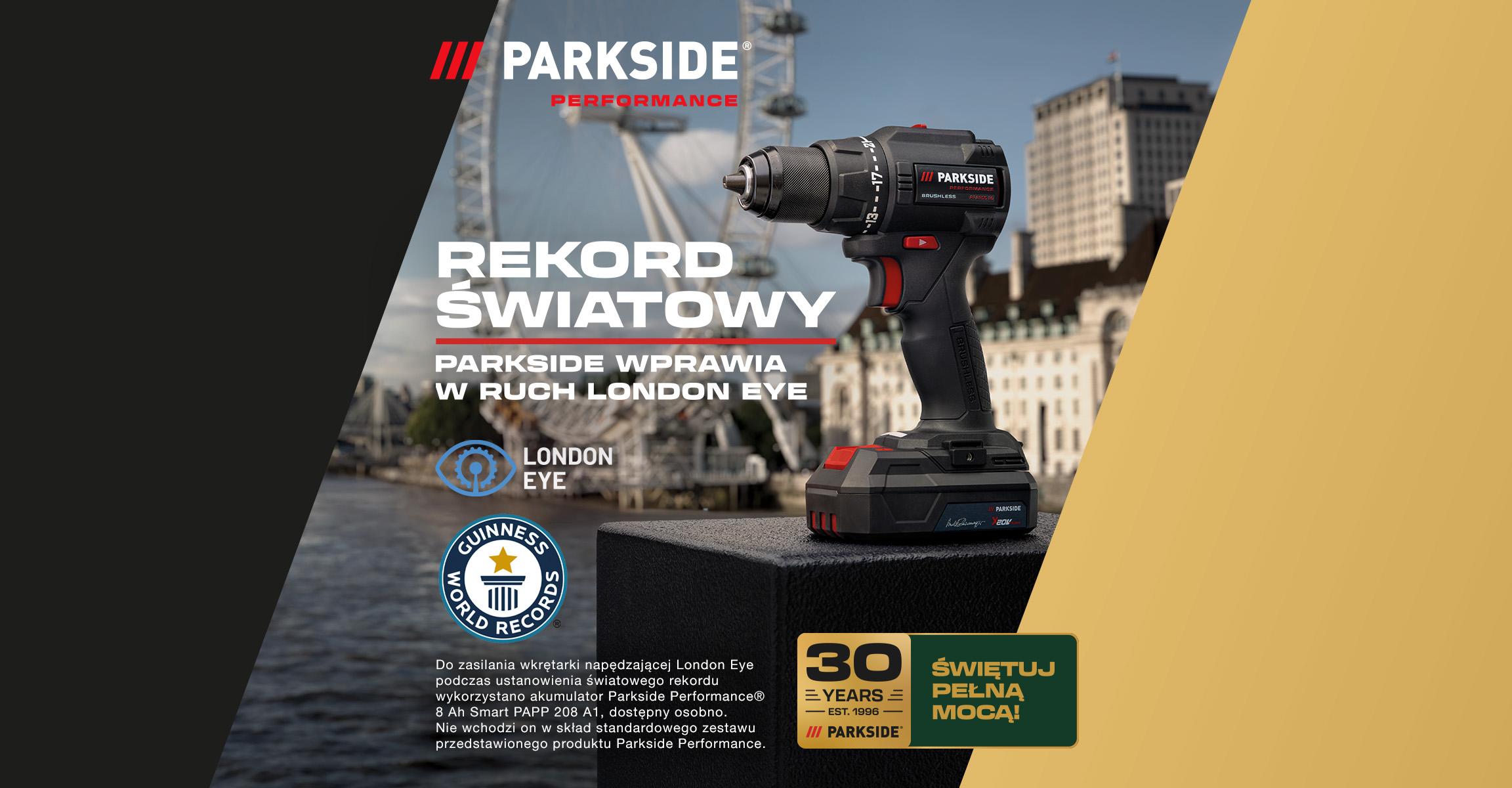 Wiertarko-wkrętarka z akumulatorem na tle London Eye, z napisem „Rekord Światowy”.