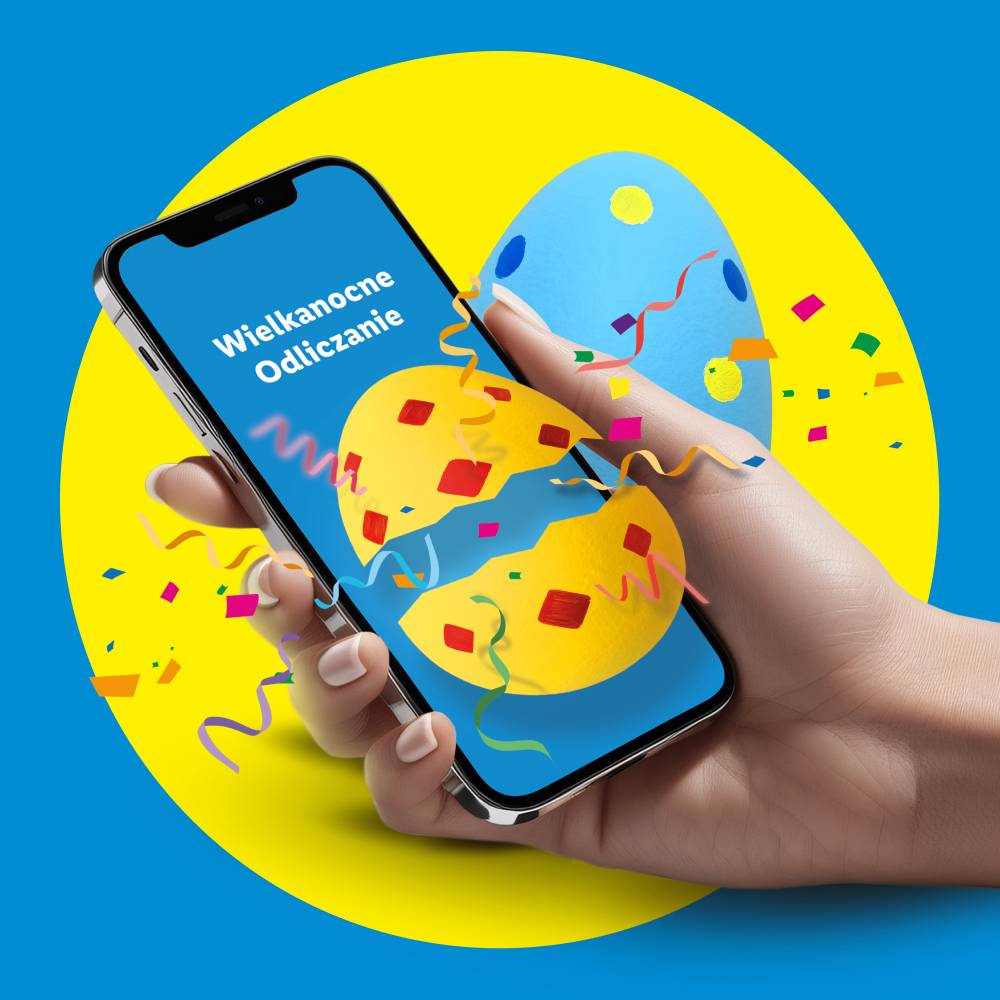 Ręka trzymająca smartfon z napisem 'Wielkanocne Odliczanie' i pękającym jajkiem na ekranie, otoczonym konfetti.