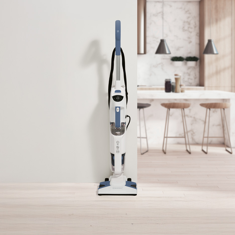 Biało-niebieski odkurzacz pionowy SilverCrest w nowoczesnej kuchni